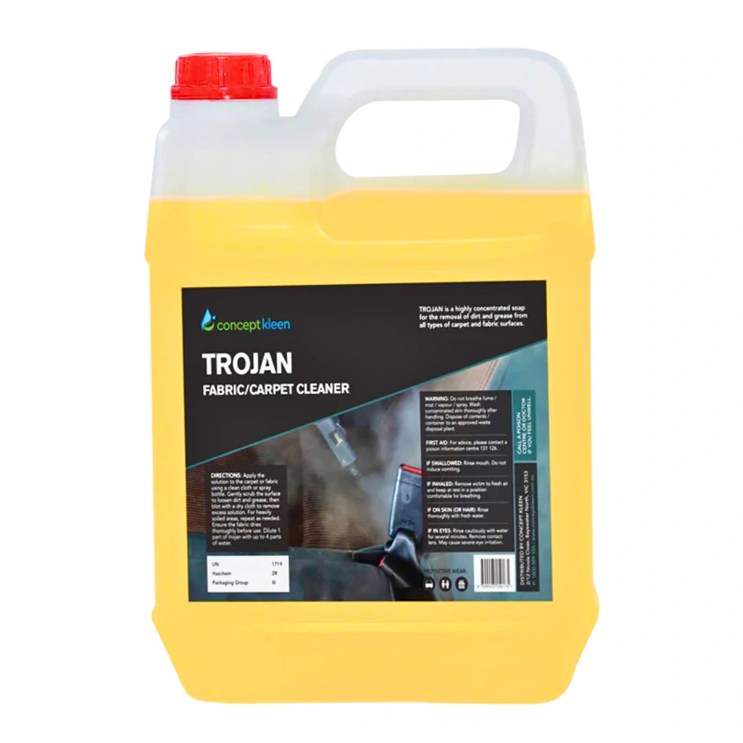 A 5-liter plastic jug of Concept Kleen Trojan Fabric/Carpet Cleaner. The container is filled with bright yellow liquid, has a translucent white upper section and handle, a red cap, and a large black label with product details.