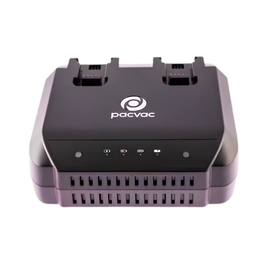 A black Pacvac dual battery charger with a white logo on the top, shown from a front-facing perspective against a plain white background.