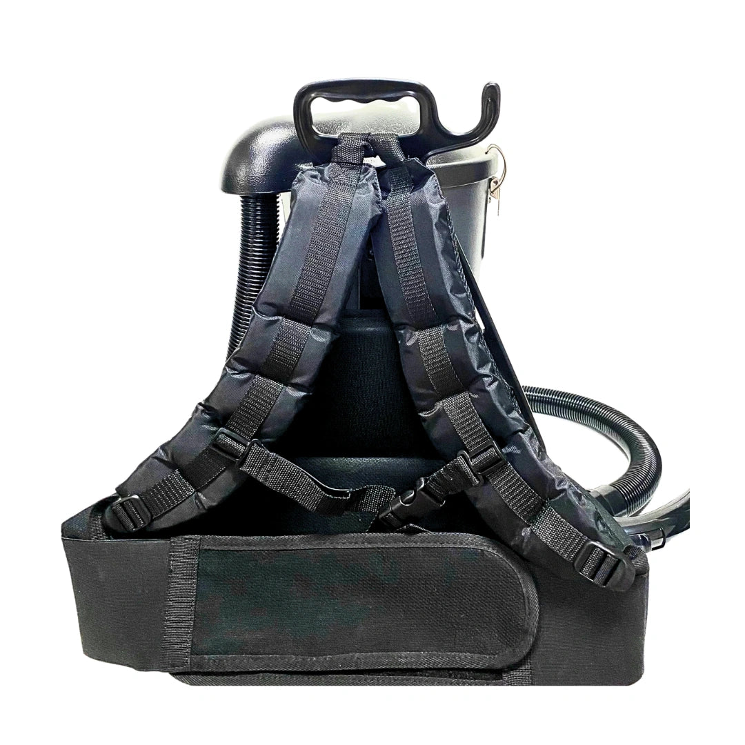 Black industrial air compressor backpack with padded shoulder straps, front utility pouch, and attached hose on a white background.