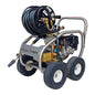 A high-pressure water washer with a black coiled hose, a black engine, and a silver metal frame with four wheels. The brand name 'Aussie Dumas' is printed on the side panel.