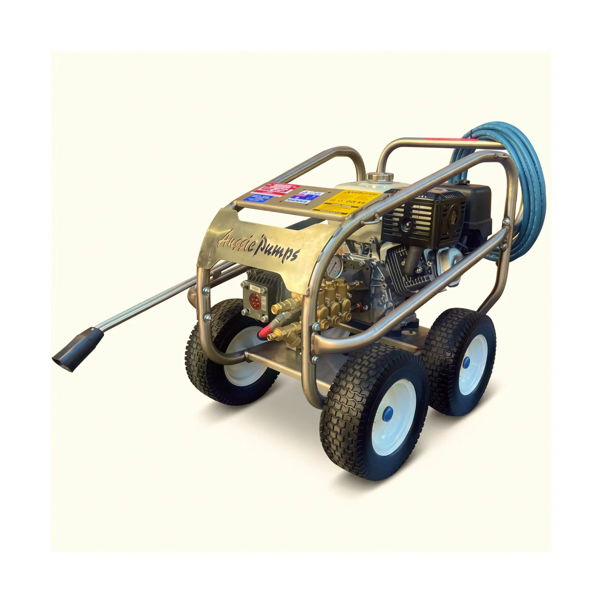 A portable high-pressure water pump with an engine, metal frame, four wheels, a blue coiled hose, and a long handpiece, photographed on a plain light beige background.