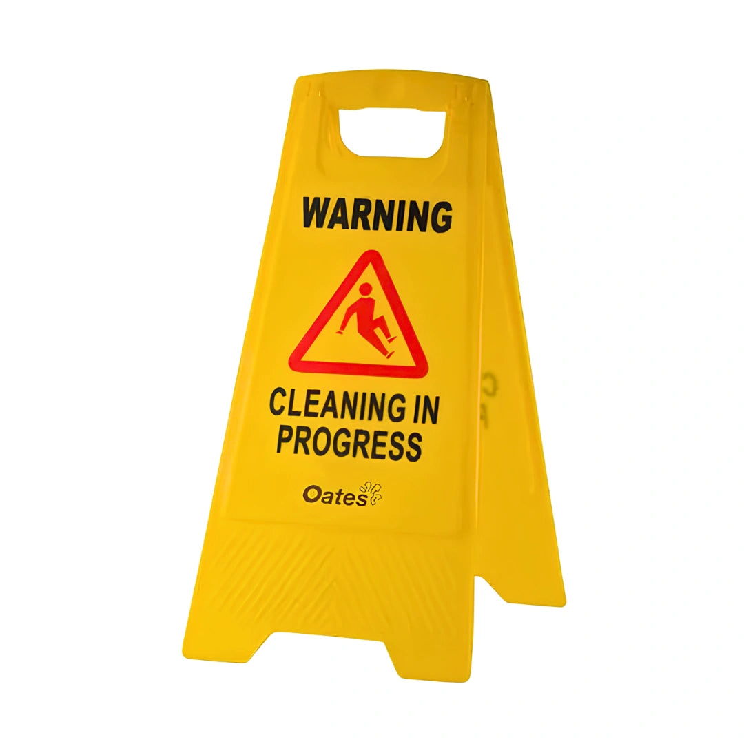 A bright yellow plastic A-frame floor sign with a handle at the top, featuring the text 'WARNING' and 'CLEANING IN PROGRESS' with a red warning triangle icon. The brand name 'Oates' is printed near the bottom.