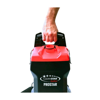 A person's hand gripping the handle of a CleanStar Prostar floor cleaner, shown against a solid white background.