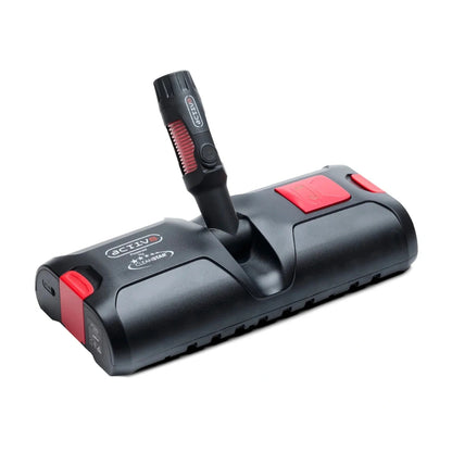 A black handheld grooming brush attachment with red accents and a vertical handle, shown on a plain white background. The brand name 'SCTD' is visible on both the handle and the body of the device.