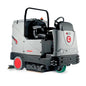 A compact industrial floor care vehicle with a gray and black body, red wheels, and a black steering cab, photographed on a plain white background.
