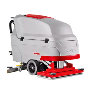 A compact commercial floor cleaner machine with a light gray body, red accents, and a rear handle, shown on a plain white background. The brand name 'COMMAX' is visible on the side, along with 'VDDA' near the front.