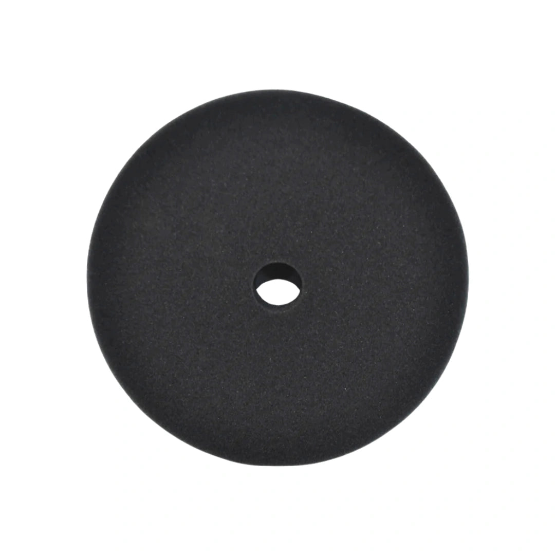 A round black foam disc with a central hole, shown against a plain white background.