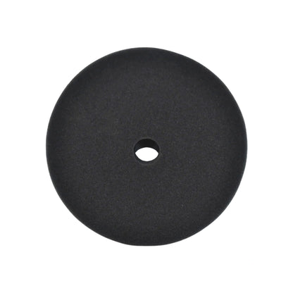 A round black foam disc with a central hole, shown against a plain white background.