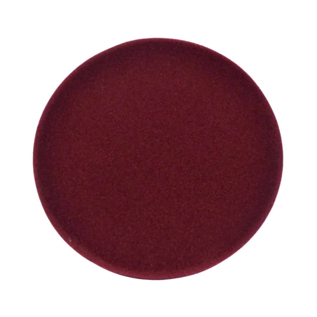 A circular fabric swatch in a deep burgundy red color, shown against a plain white background.