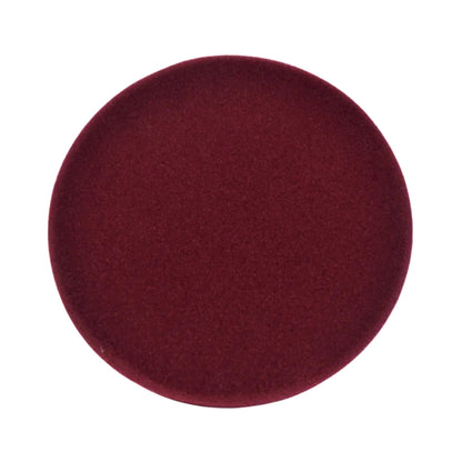 A circular fabric swatch in a deep burgundy red color, shown against a plain white background.