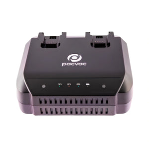 A black Pacvac dual battery charger with a white logo on the top, shown from a front-facing perspective against a plain white background.