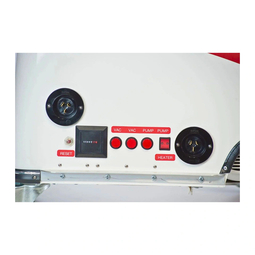 Close-up of a white appliance control panel with black circular dials, red buttons, and labels including RESET, VAC, PUMP, PLUMP, and HEATER.