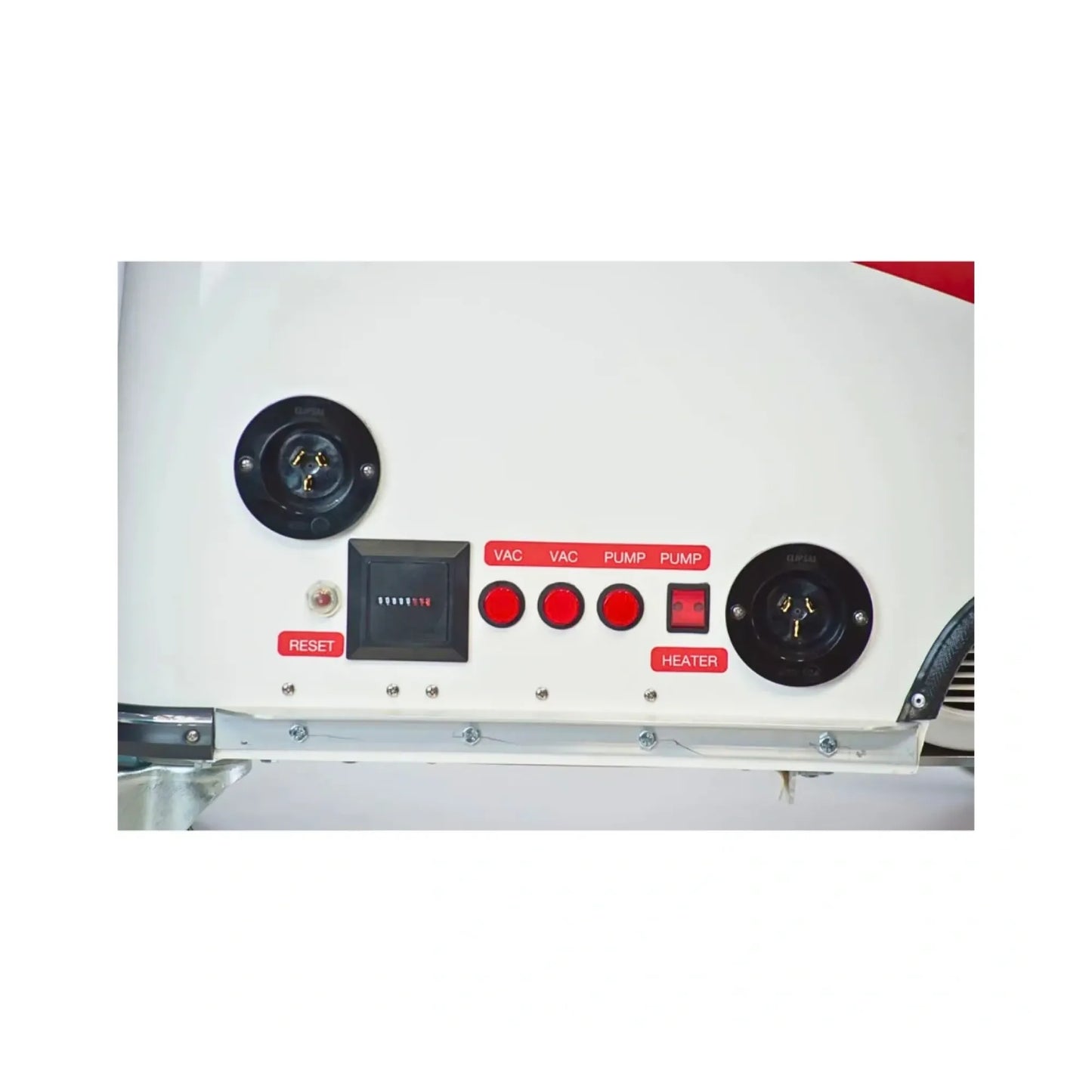 Close-up of a white appliance control panel with two black circular electrical outlets, three red buttons labeled VAC, PUMP, and PLMJP, a small digital display, and red labels including RESET and HEATER.