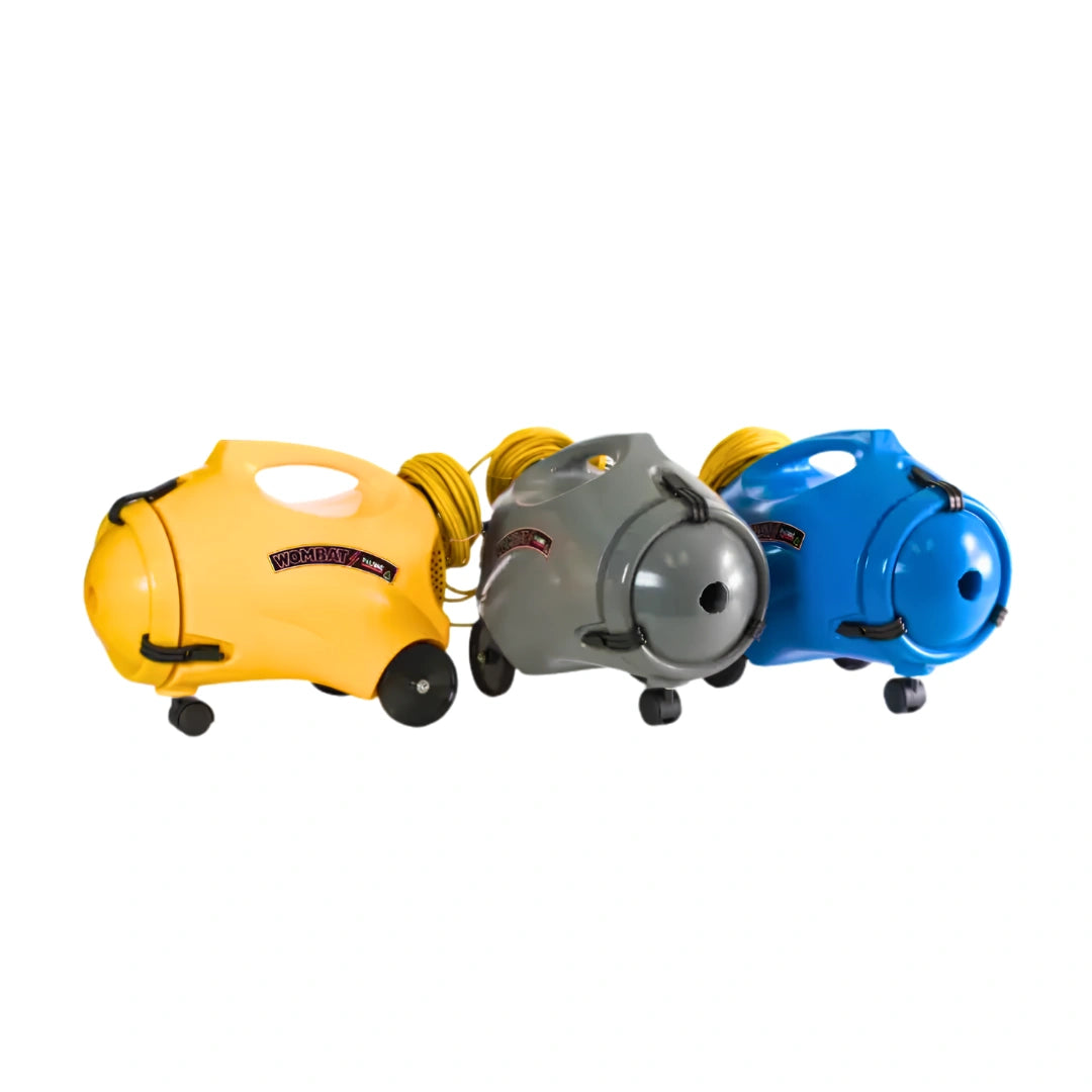 Three cordless vacuum cleaners in yellow, gray, and blue, arranged side by side on a plain white background.