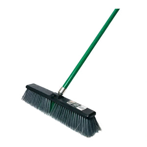 A green-handled push broom with a black plastic head and dark gray bristles, photographed on a plain white background.