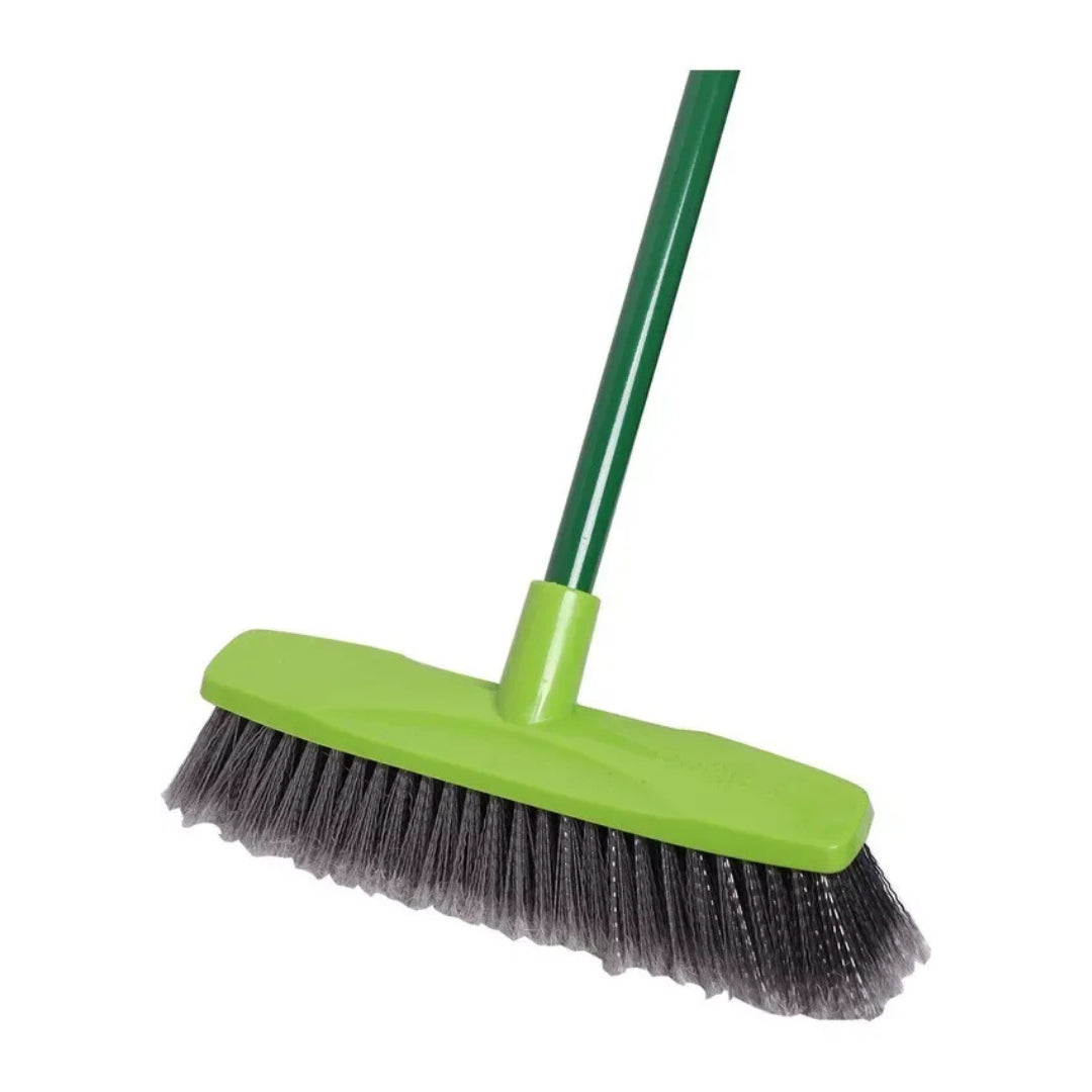 A green-handled push broom with a bright lime green plastic head and dark gray bristles, shown on a plain white background.