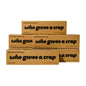 Five brown cardboard boxes of bamboo paper towels stacked in a pyramid arrangement on a plain white background. The boxes feature black text that reads '100% Bamboo Paper Towels who gives a crap'.