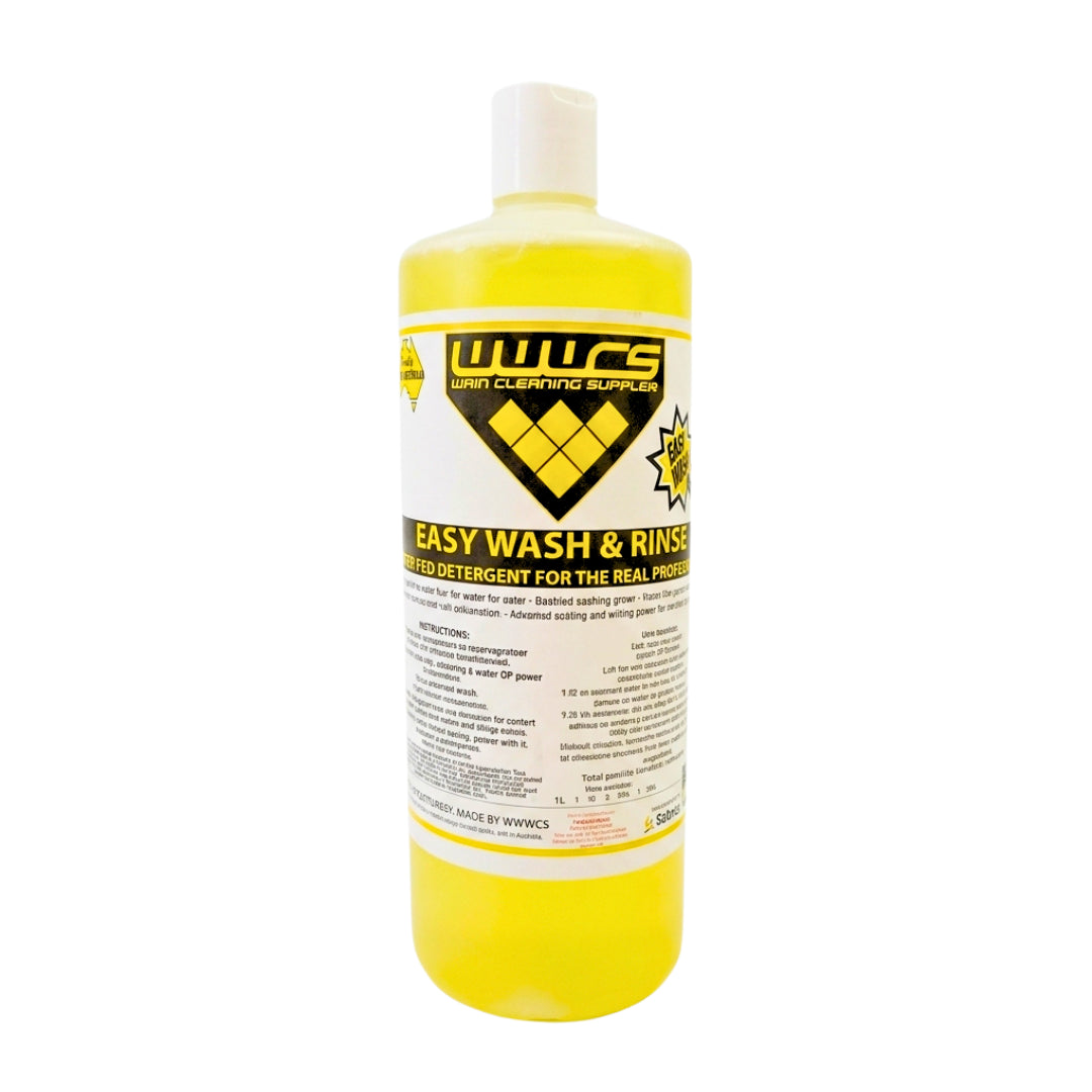 A bottle of WWCS Easy Wash & Rinse liquid detergent for real motor oil, filled with bright yellow liquid and featuring a white cap on a white background.