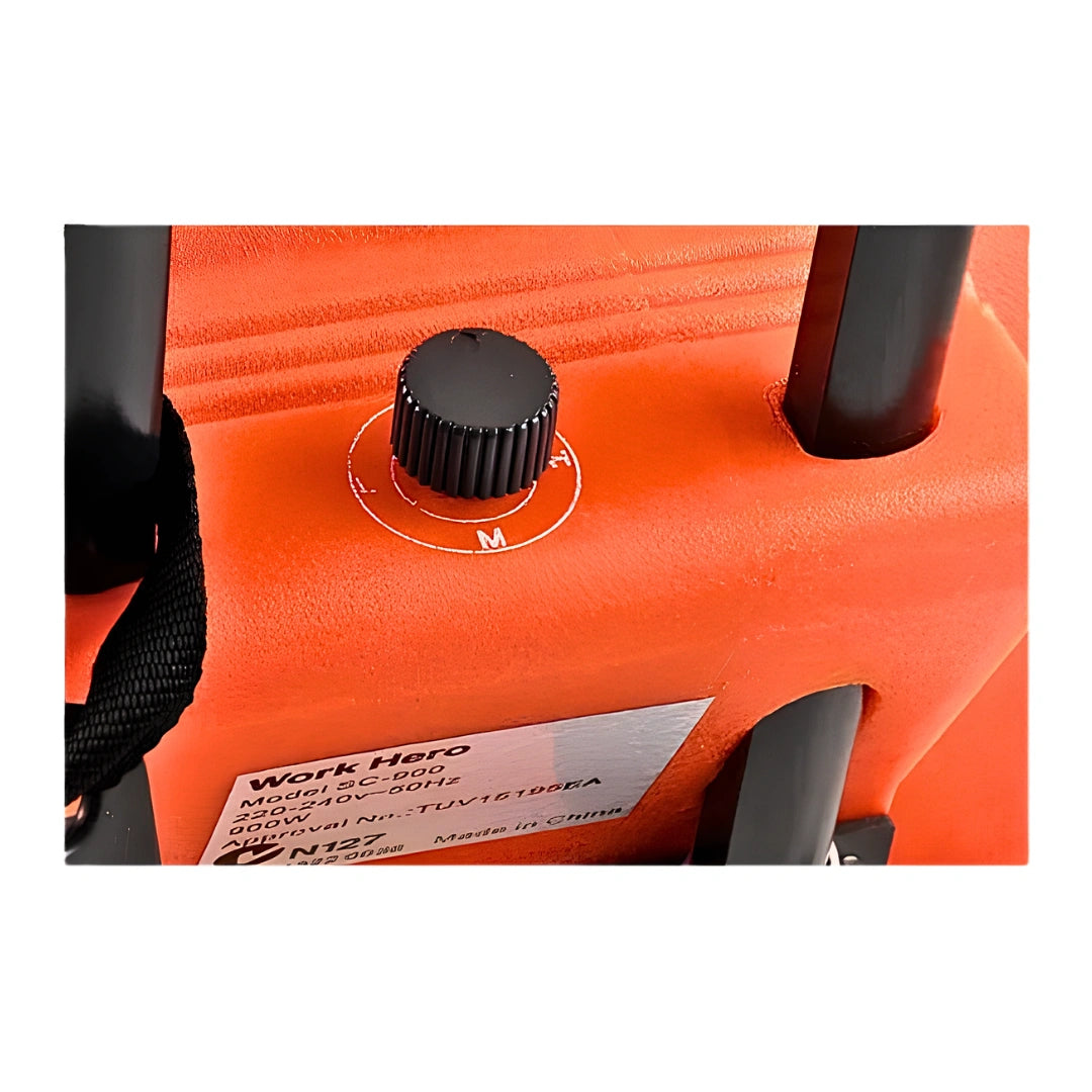 Close-up of an orange Work Hero cordless vacuum cleaner showing a black dial control, black handle components, and a silver product label.