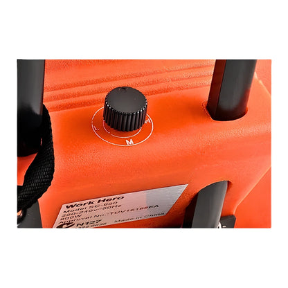 Close-up of an orange Work Hero cordless vacuum cleaner showing a black dial control, black handle components, and a silver product label.
