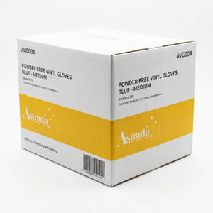 A white cardboard box of Astrada Powder Free Vinyl Gloves in Blue - Medium, featuring a bold yellow band with the Astrada logo on the front and side.