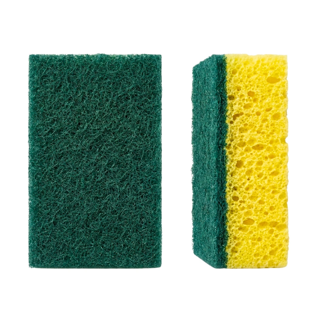 Two rectangular cleaning sponges on a plain white background: one dark green abrasive scrubber on the left, and one yellow porous sponge with a green side on the right.