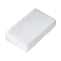 A rectangular white foam sponge block with a textured, porous surface, shown at an angle on a plain white background.