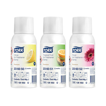 Three white Tork Premium Air Freshener Spray bottles on a white background, labeled Citrus, Tropical Fruit, and Floral.