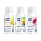 Three white Tork Premium Air Freshener Spray bottles on a white background, labeled Citrus, Tropical Fruit, and Floral.
